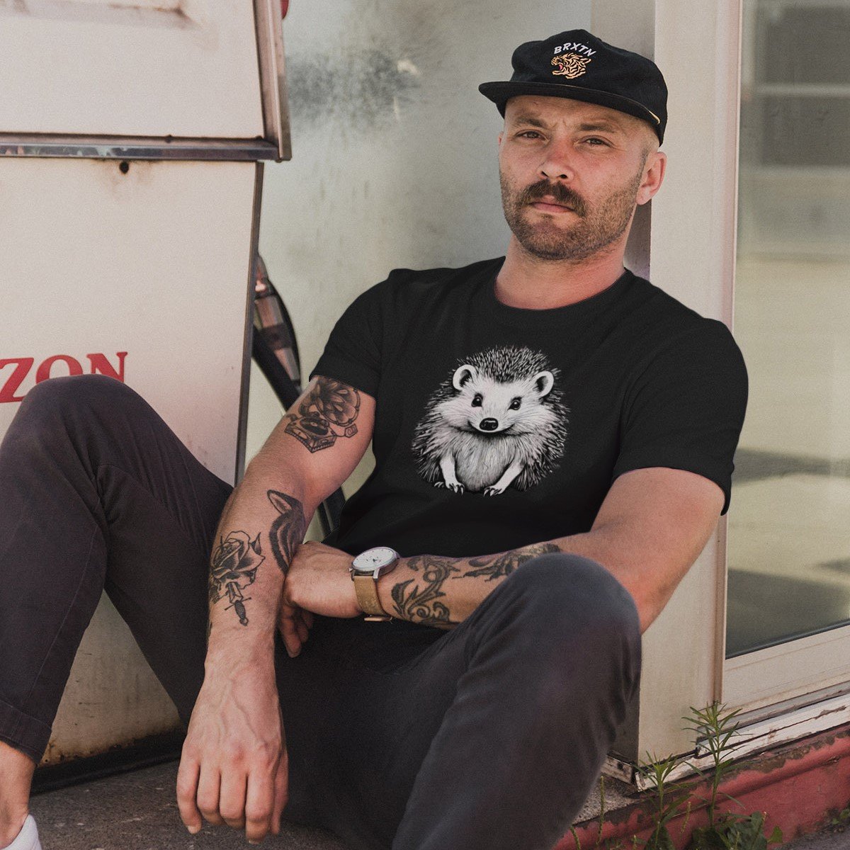 man wearing black t-shirt with hedgehog image